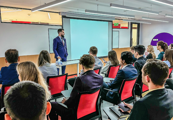 Enrolia founders training an education sales team